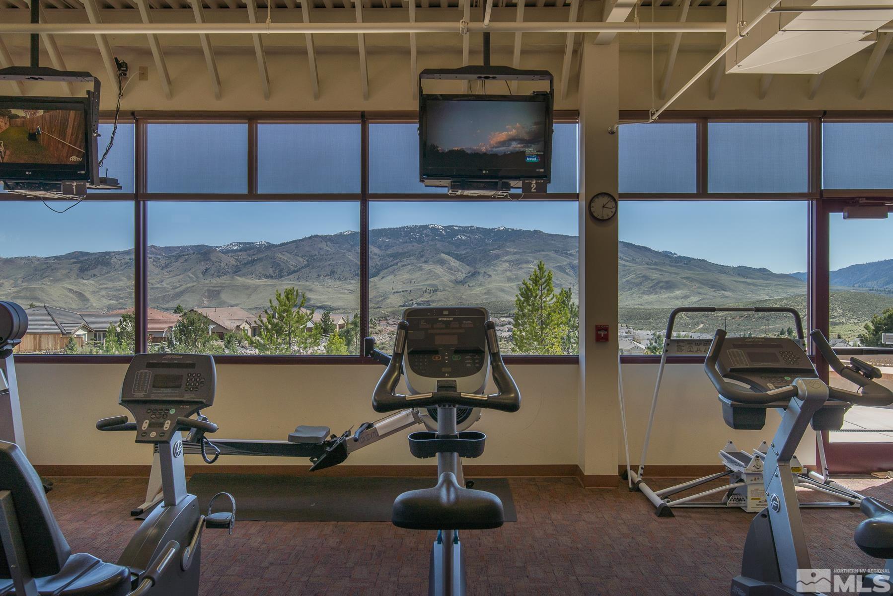 9207 Sassafras Trail Reno, NV 89523 - Photo 36 of 40 a room with gym equipment and a view of living room