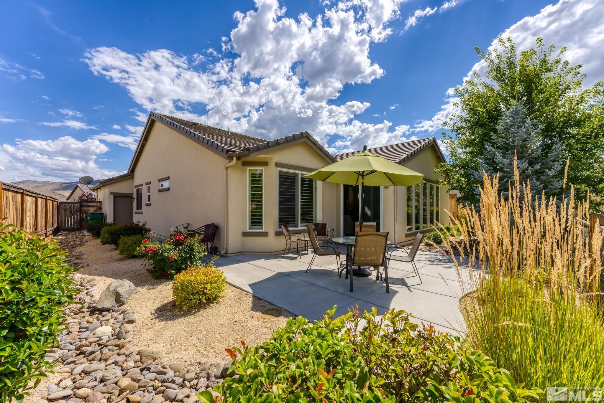 9207 Sassafras Trail Reno, NV 89523 - Photo 5 of 40 a view of a house with swimming pool and sitting area