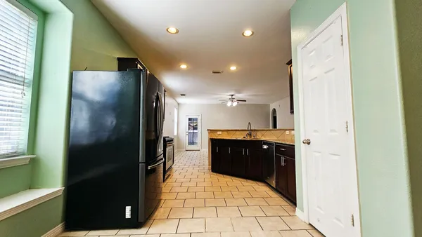 a bathroom with a glass shower door and a mirror