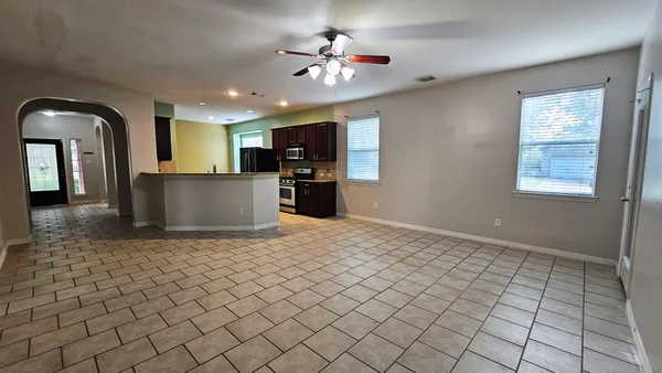 a view of a kitchen with a sink and a stove top oven