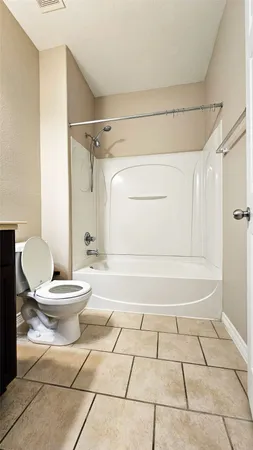 a bathroom with a toilet a sink and a shower