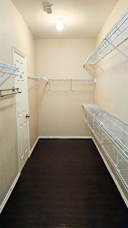 a view of a room with racks on the wall