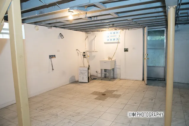 a bathroom with a toilet and bathtub
