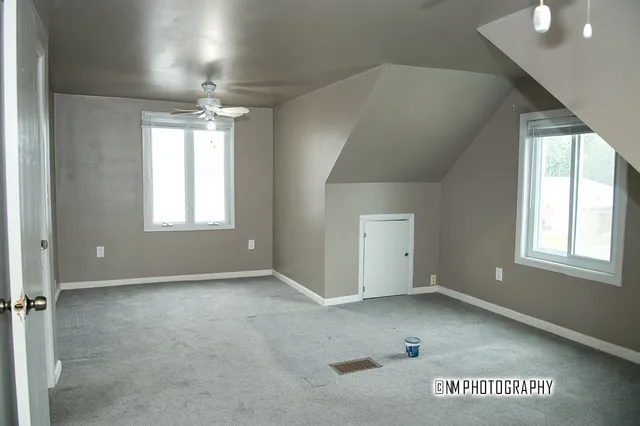 a view of an empty room and window