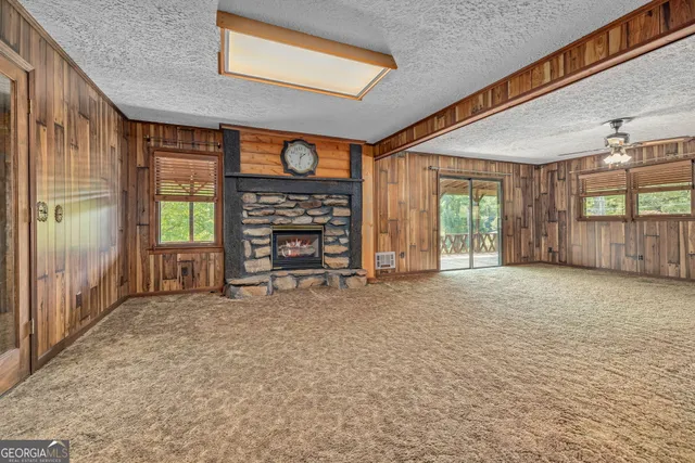 a dining room with furniture and a window