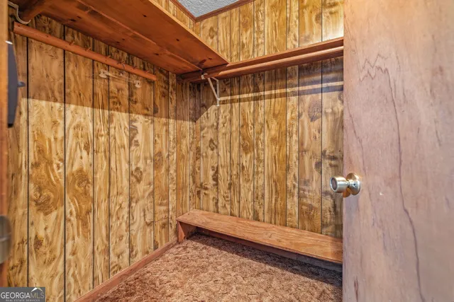 a view of a barn house in the middle of a yard