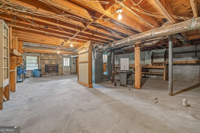 a view of a house with a yard and sitting area