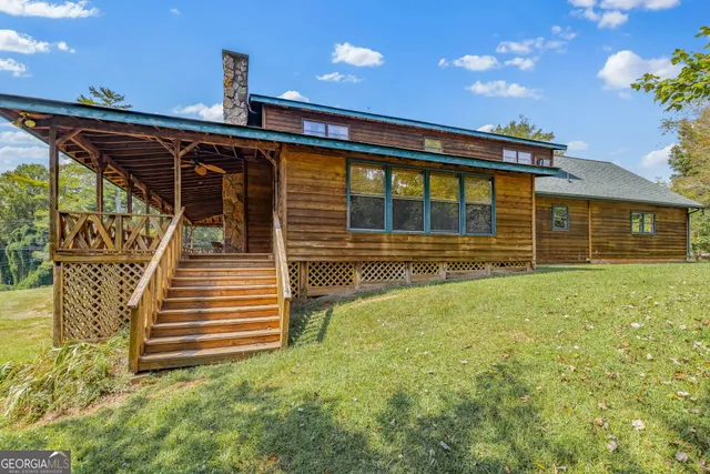 a view of a park with large trees