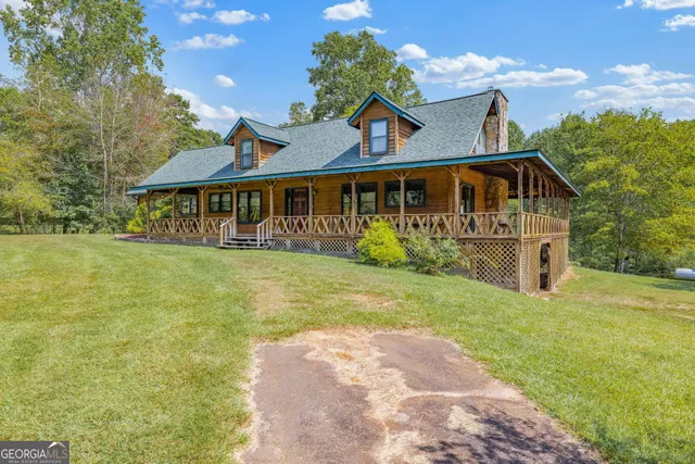a view of a yard with large trees