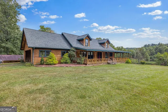 a view of a lake with a forest