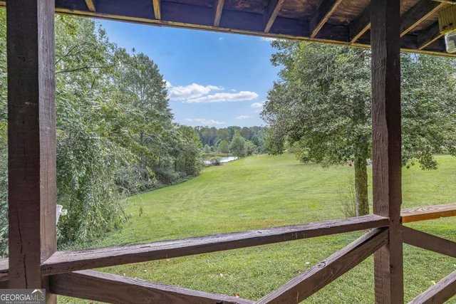 an aerial view of a house with yard outdoor seating and entertaining space