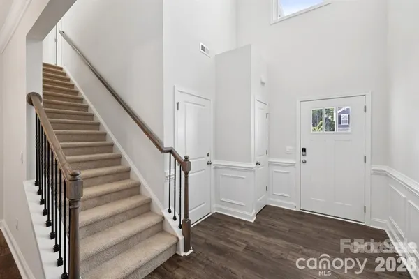a view of an entryway with wooden floor