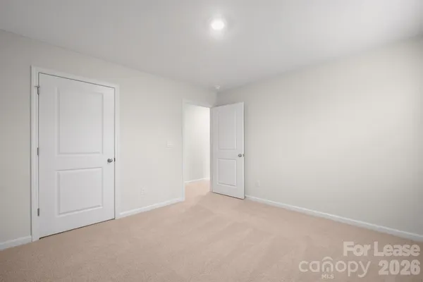 a bathroom with a granite countertop sink a mirror and a shower