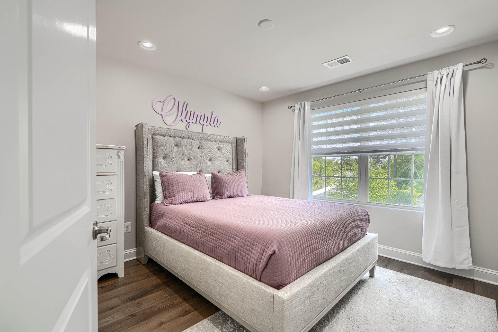 2707 Lady Slipper Road Gambrills, MD 21054 - Photo 28 of 60 a bedroom with a large bed and a window