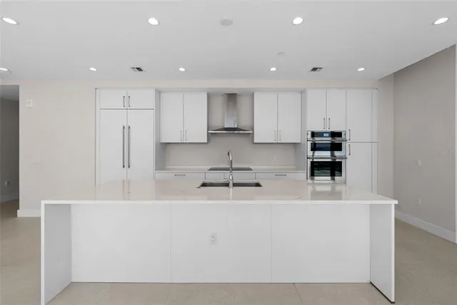 a view of an empty room with glass door