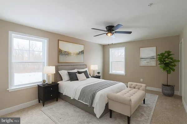 a bedroom with bed and a chandelier