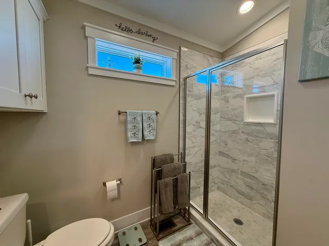 a view of a balcony with chair and front door