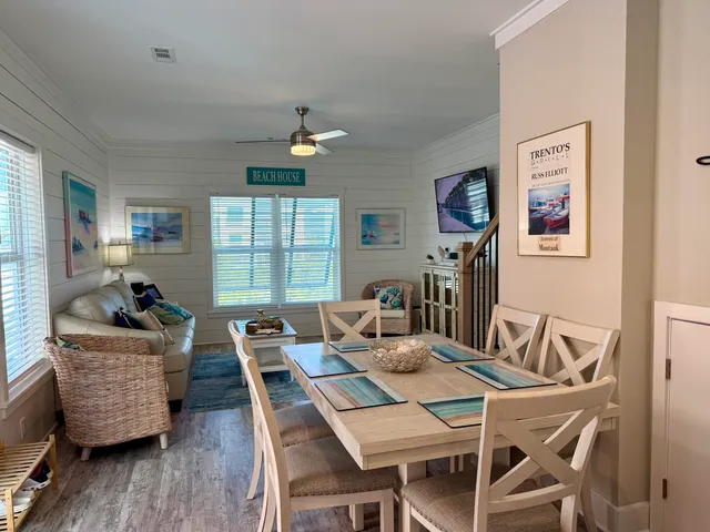 a dining room with furniture and window