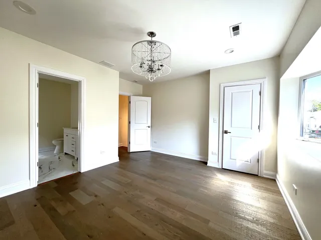 a bathroom with double vanity sink and mirror