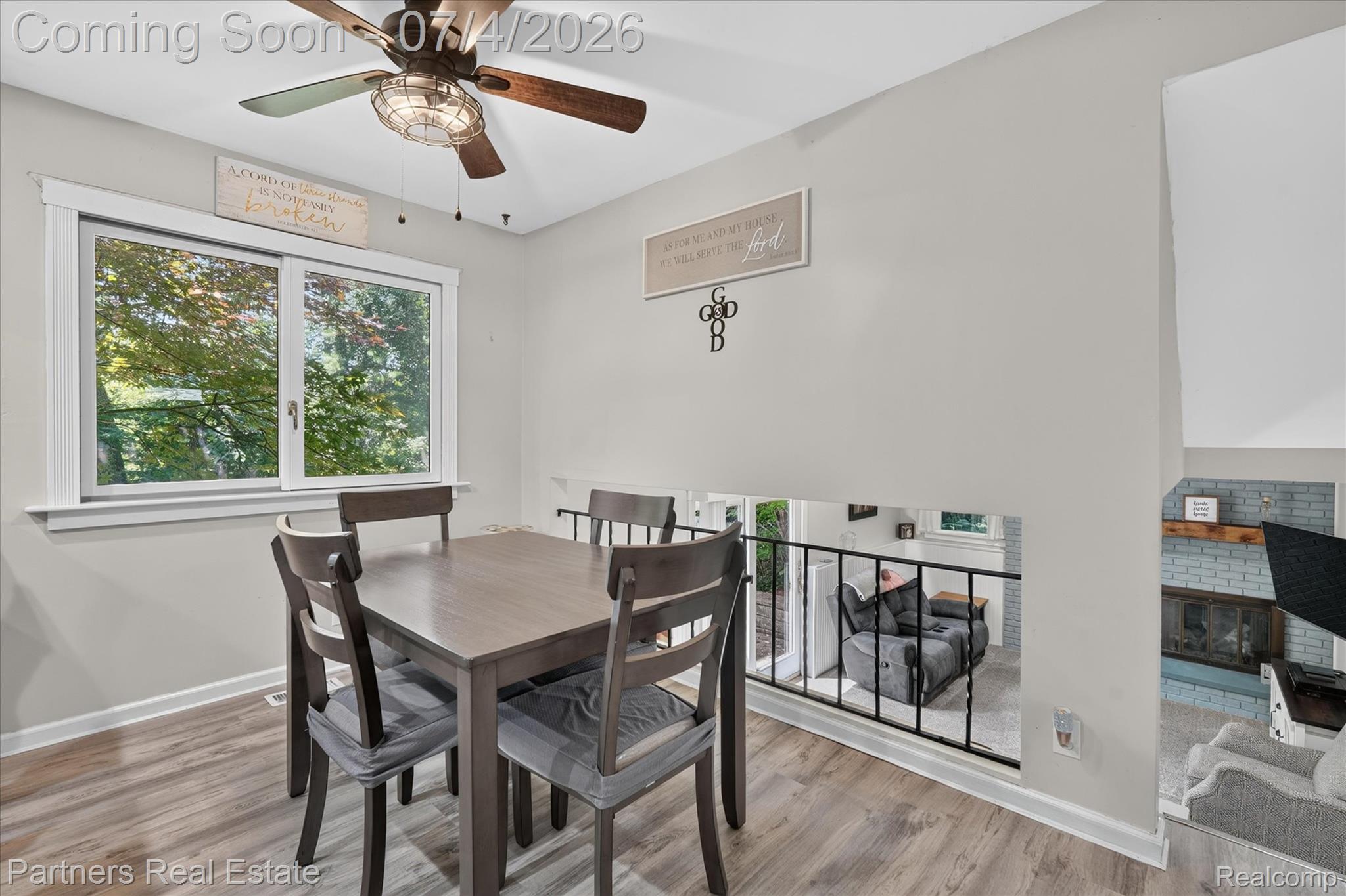 2500 Hubert Road Brighton, MI 48114 - Photo 18 of 53 Dining area featuring wood-finish flooring and a ceiling fan with integrated lighting