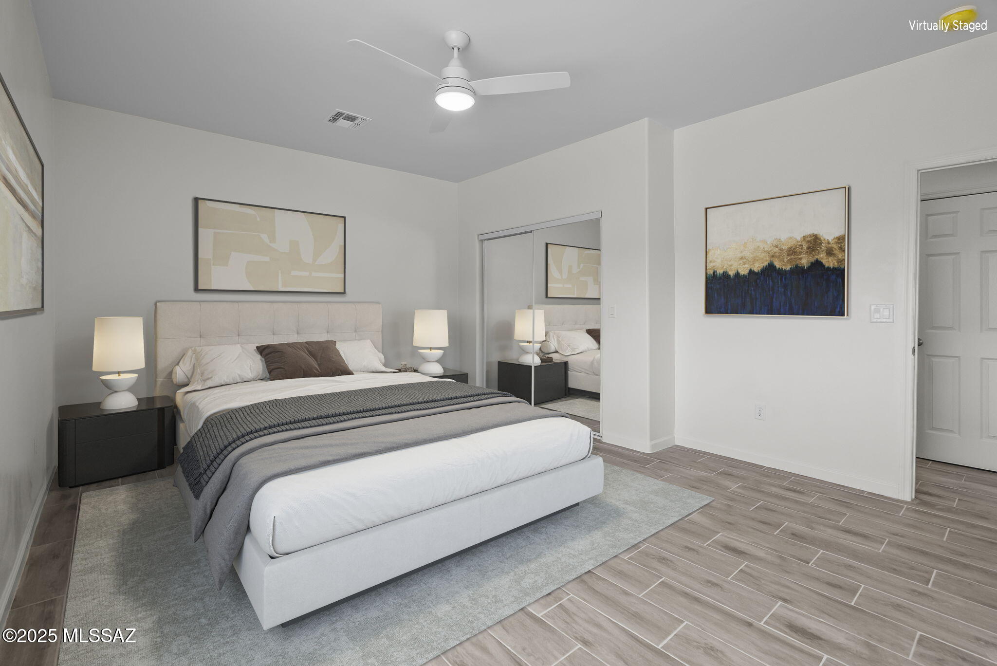 1895 Roma Court Rio Rico, AZ 85648 - Photo 17 of 42 a bedroom with a bed and a painting on the wall