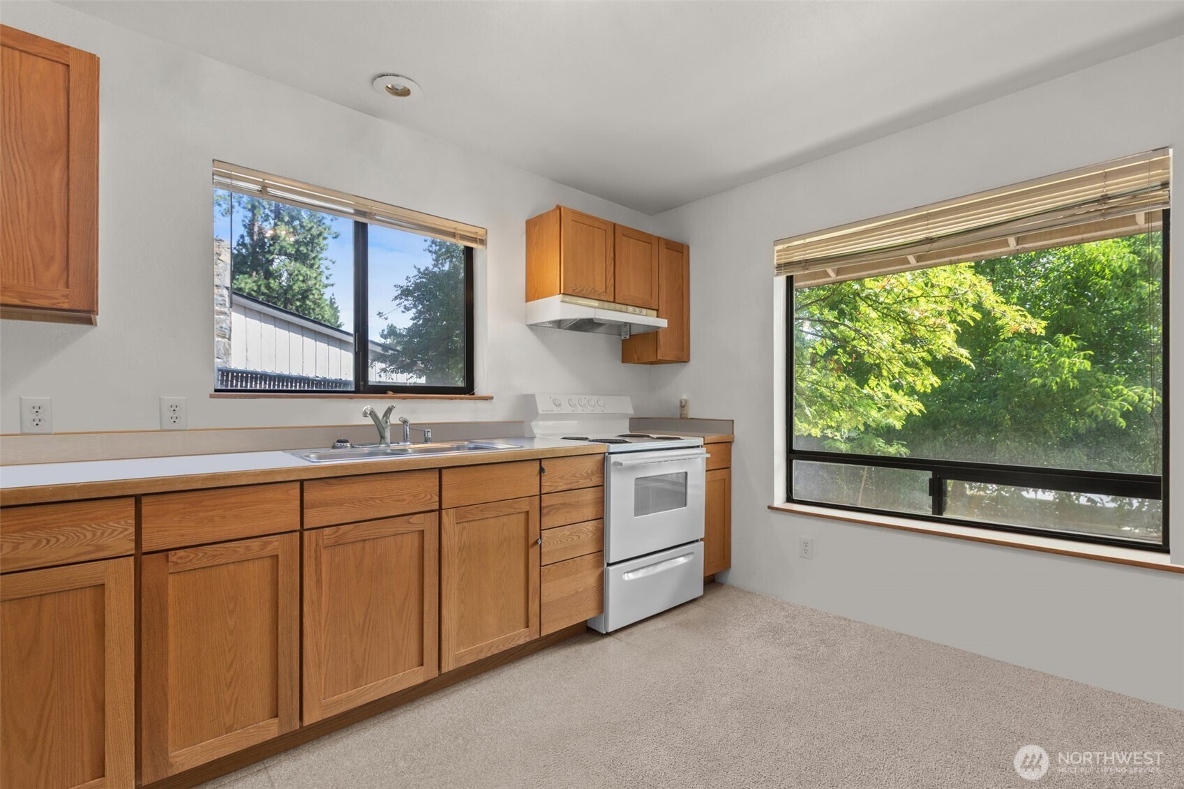 8480 Icicle Road Leavenworth, WA 98826 - Photo 12 of 40 a spacious bathroom with a double vanity sink and a large window