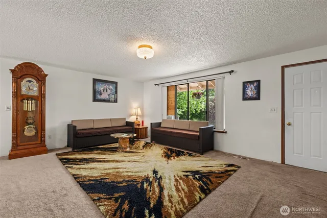 a bedroom with furniture and a window