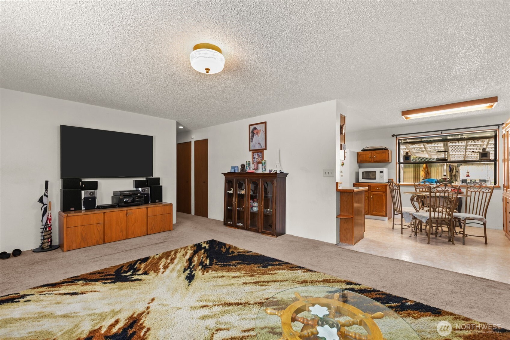 8480 Icicle Road Leavenworth, WA 98826 - Photo 5 of 40 a bedroom with furniture and a flat screen tv