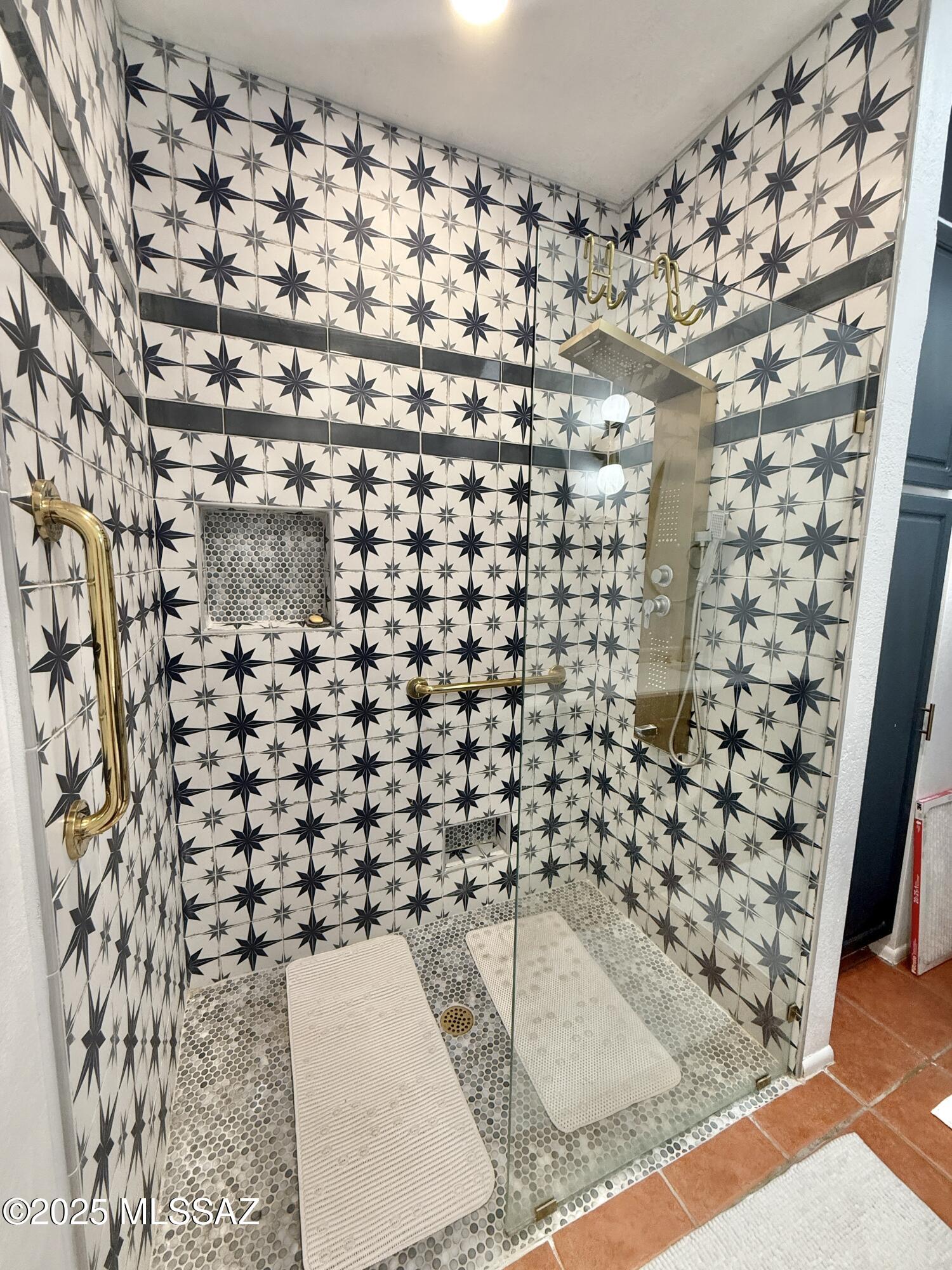 8110 East Rivenoak Circle Tucson, AZ 85715 - Photo 16 of 29 a bathroom with a bathtub and shower