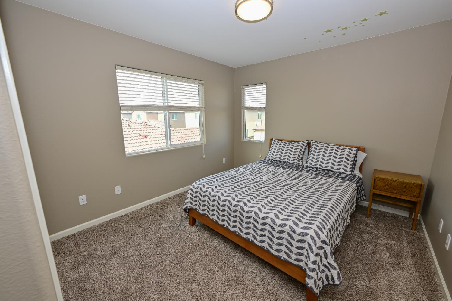 3569 Flint Avenue Clovis, CA 93619 - Photo 19 of 25 a bedroom with a bed and window