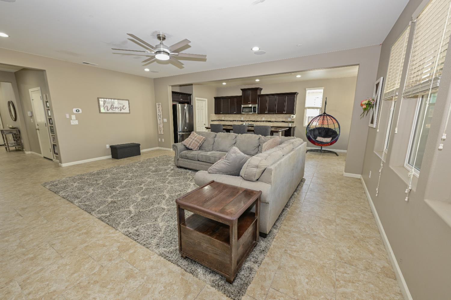 3569 Flint Avenue Clovis, CA 93619 - Photo 3 of 25 a living room with furniture and a chandelier