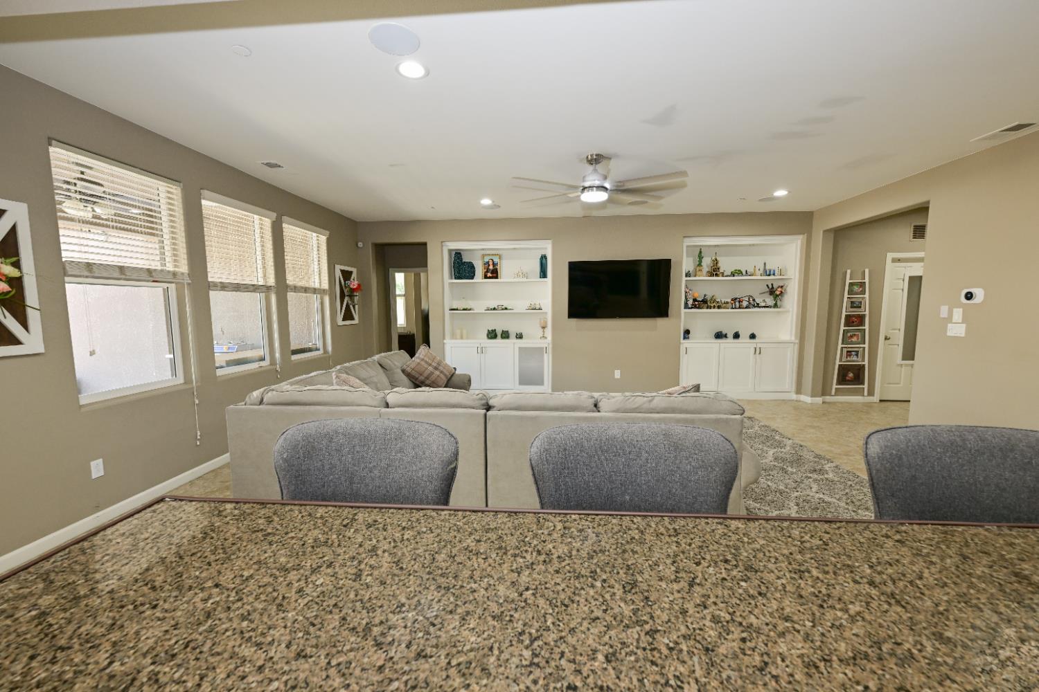 3569 Flint Avenue Clovis, CA 93619 - Photo 5 of 25 a living room with furniture window and a flat screen tv