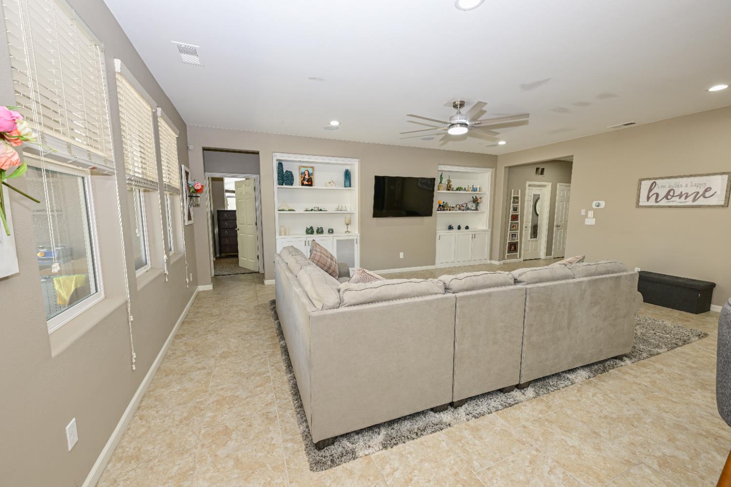3569 Flint Avenue Clovis, CA 93619 - Photo 9 of 25 a living room with furniture and a flat screen tv