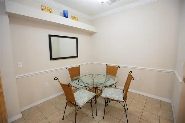 a view of a dining room with furniture and a table and chair