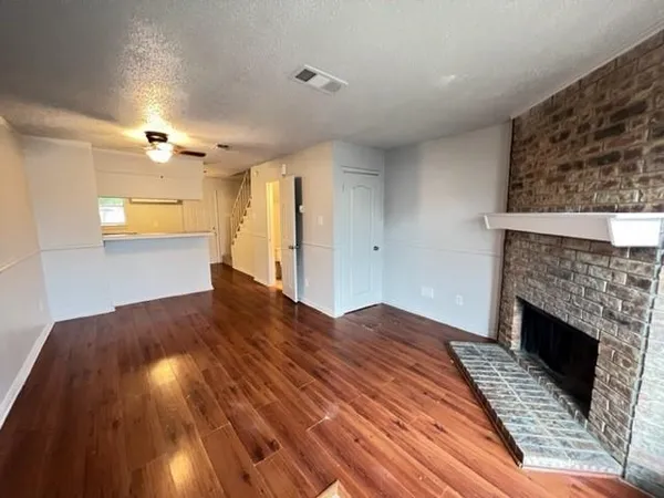 a bedroom with a bed and a fireplace