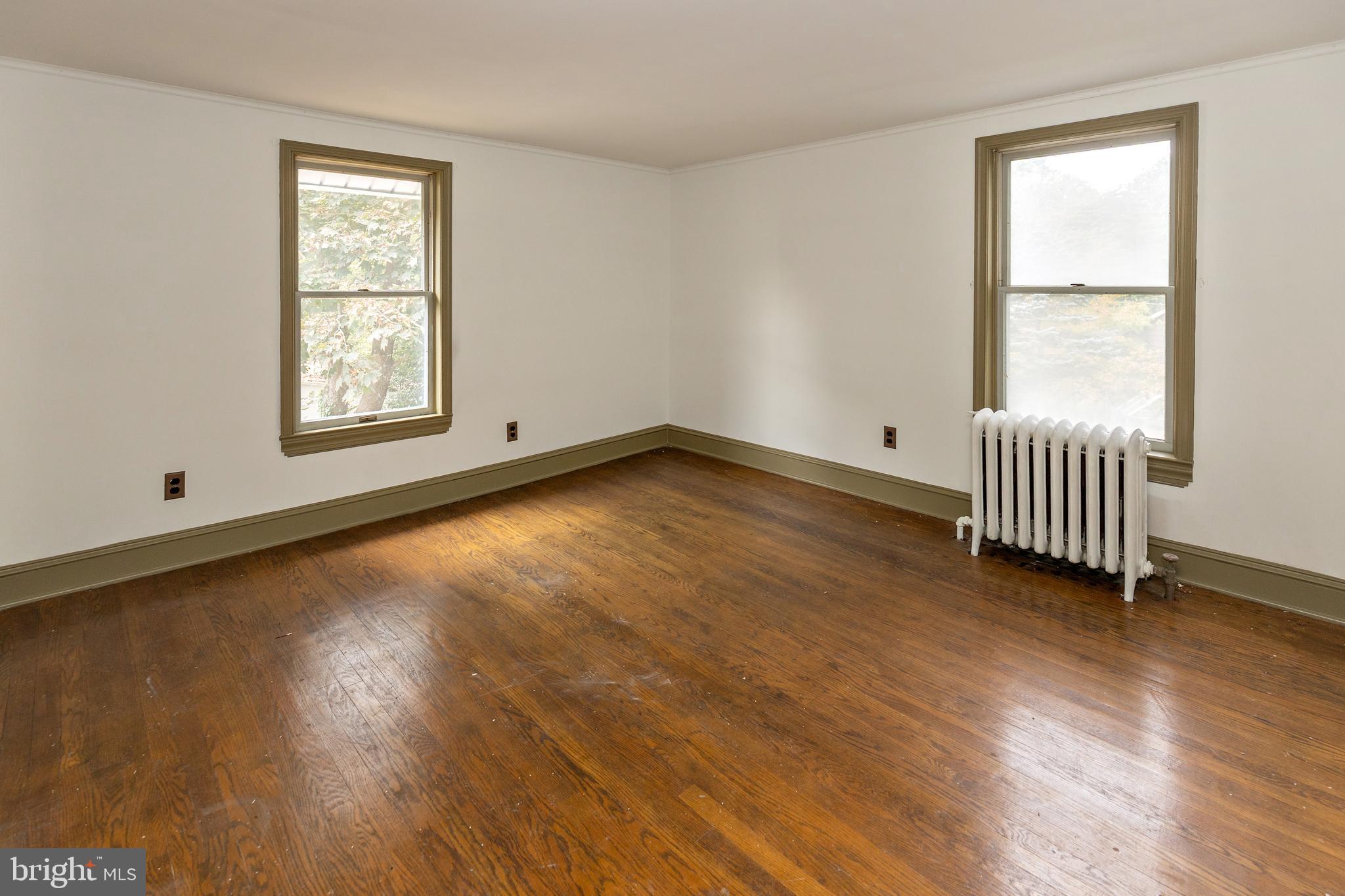 15 Jerome Terrace Clementon, NJ 08021 - Photo 20 of 33 a view of an empty room with wooden floor and a window