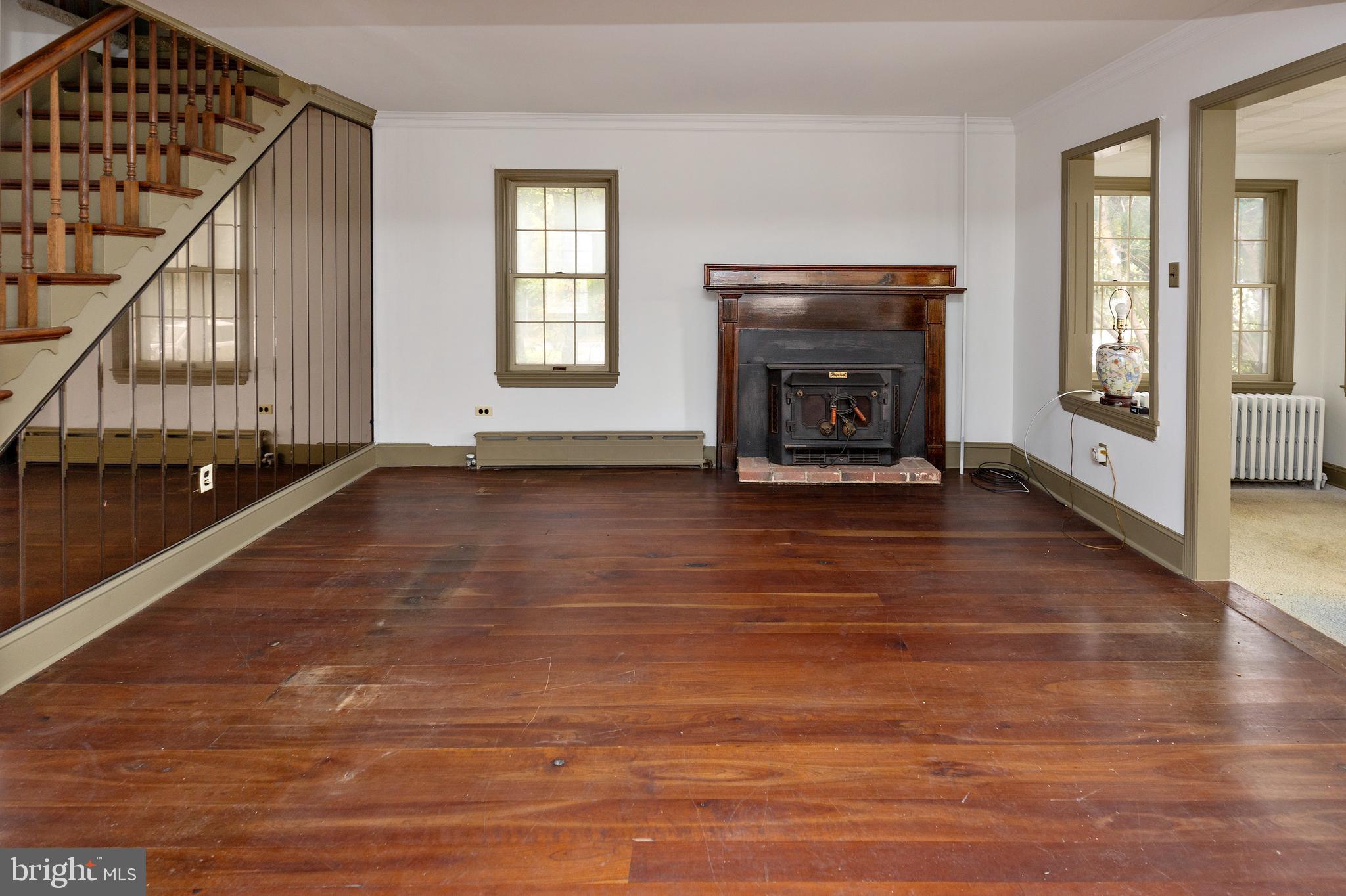 15 Jerome Terrace Clementon, NJ 08021 - Photo 3 of 33 a view of an empty room with glass door and wooden floor