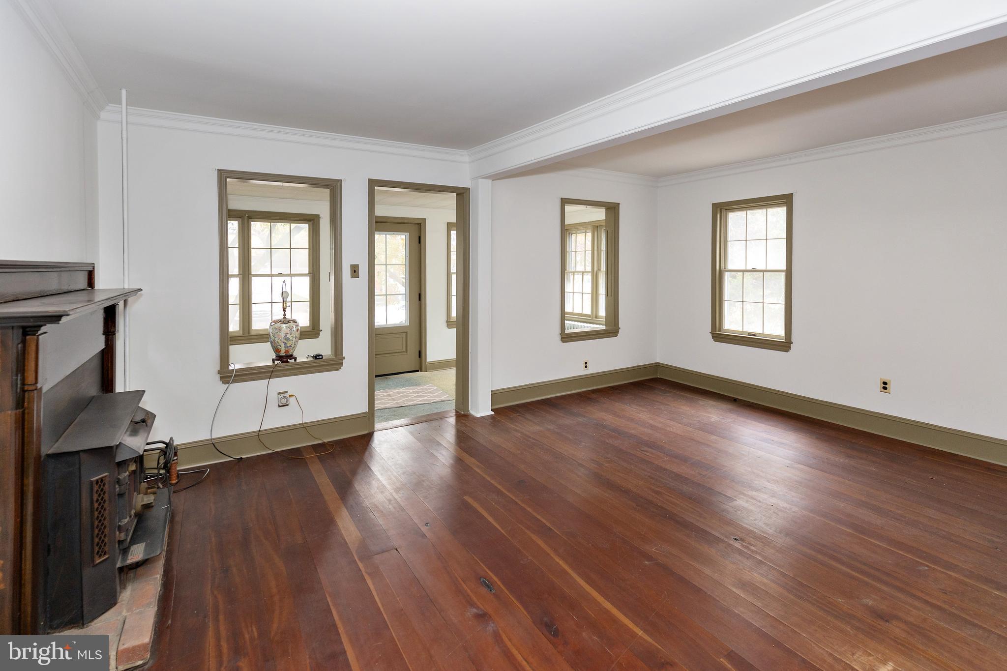 15 Jerome Terrace Clementon, NJ 08021 - Photo 6 of 33 a view of a livingroom with wooden floor and windows