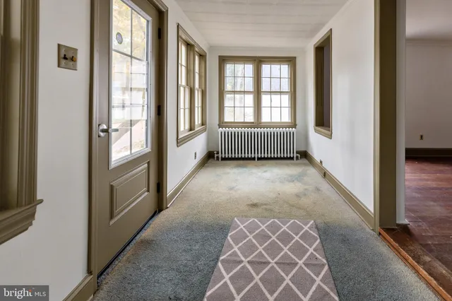 a view of an empty room and a window