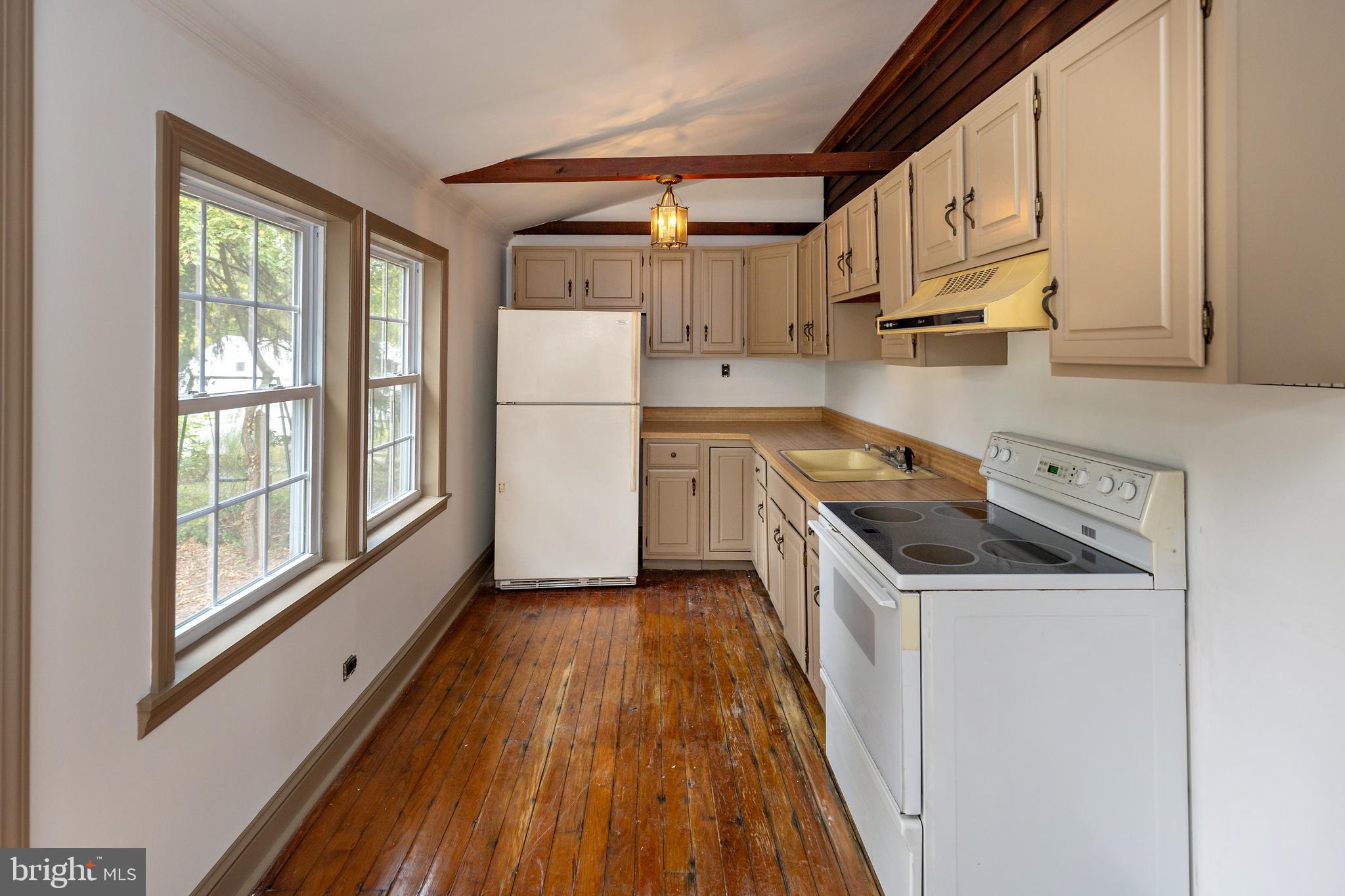 15 Jerome Terrace Clementon, NJ 08021 - Photo 9 of 33 a kitchen with a sink a refrigerator and window