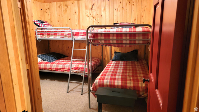 6210 Mountain View Road, Unit 133 Coalville, UT 84017 - Photo 67 of 87 The lower level bunk room with 2 sets of twin beds. Bunk room has no window. There are 2 outside exit doors close by in the family room and the utility room.
