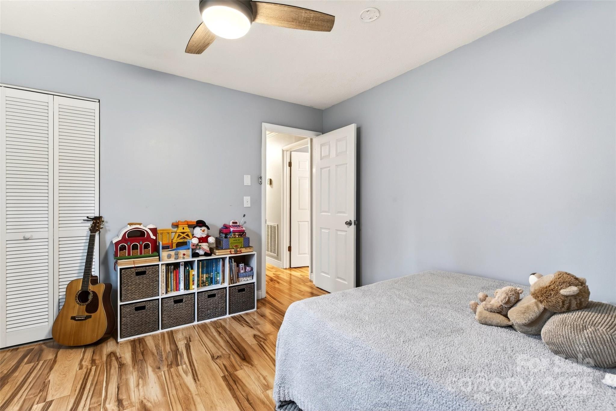 45 Due West Road Hendersonville, NC 28792 - Photo 22 of 45 a bedroom with a bed and a closet