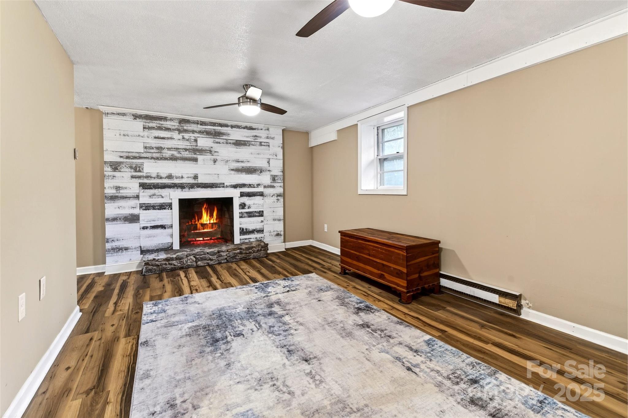 45 Due West Road Hendersonville, NC 28792 - Photo 25 of 45 a living room with furniture and a fireplace