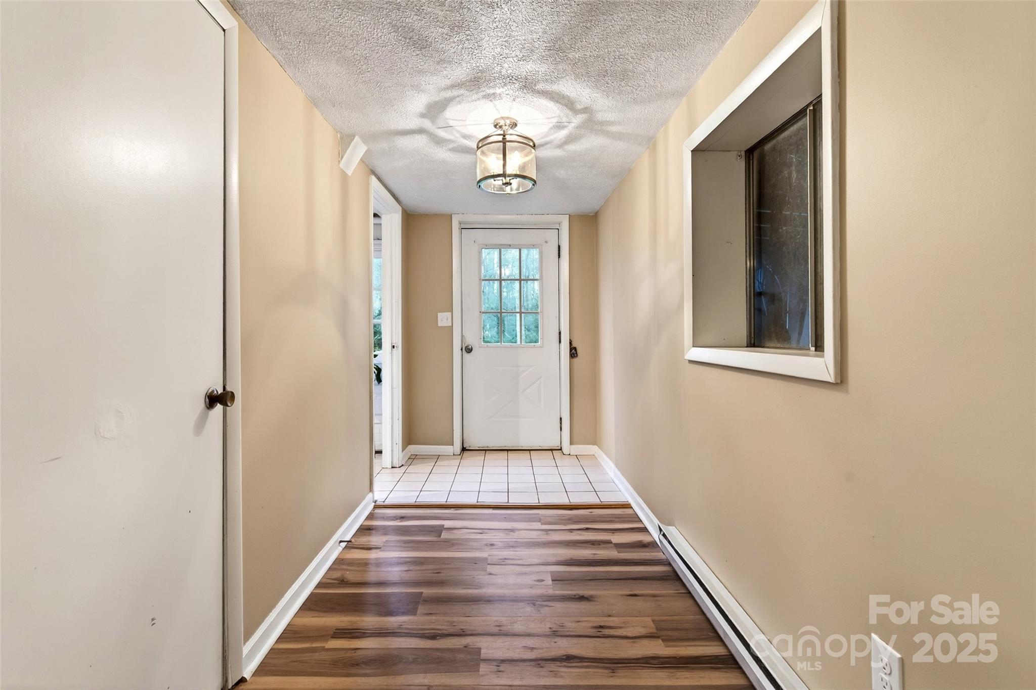 45 Due West Road Hendersonville, NC 28792 - Photo 29 of 45 a view of a hallway with wooden floor and staircase