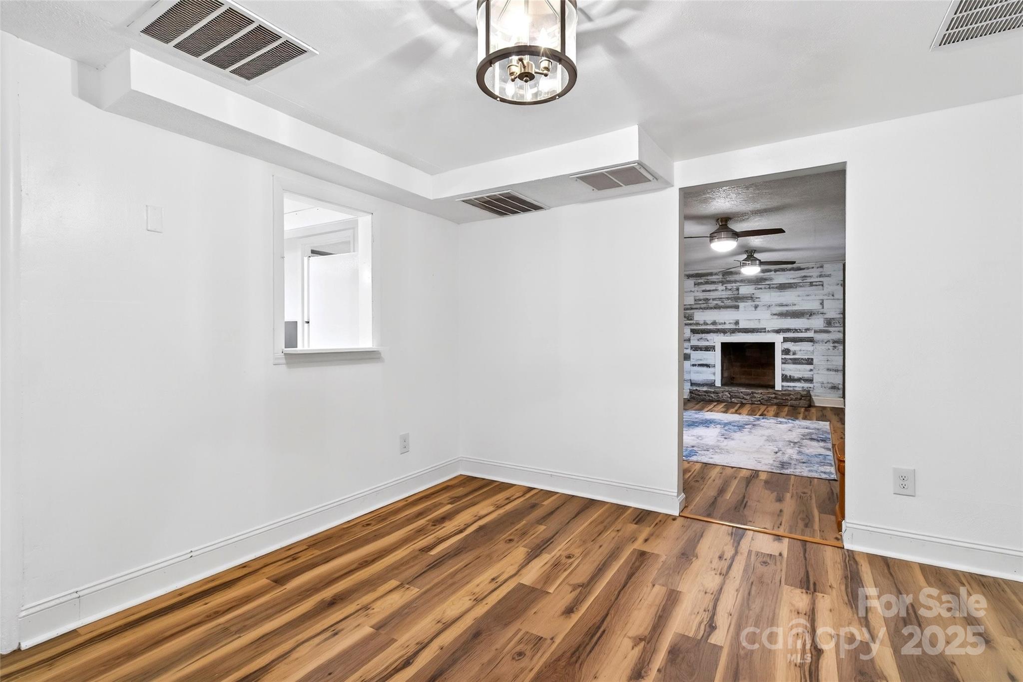 45 Due West Road Hendersonville, NC 28792 - Photo 30 of 45 a view of empty room with wooden floor and fan