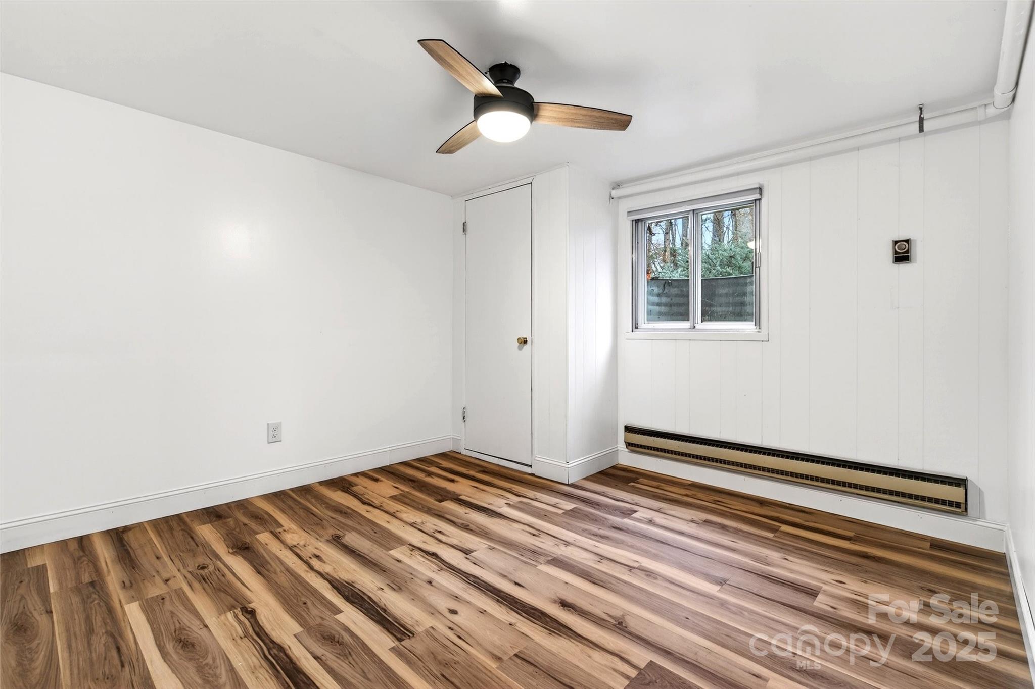 45 Due West Road Hendersonville, NC 28792 - Photo 33 of 45 a view of an empty room with wooden floor and a window