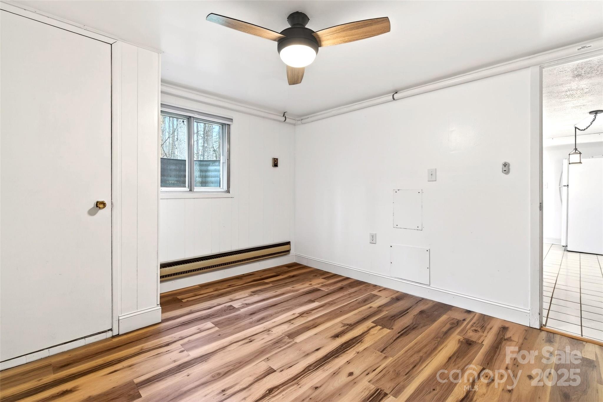 45 Due West Road Hendersonville, NC 28792 - Photo 34 of 45 a view of an empty room with wooden floor and a window