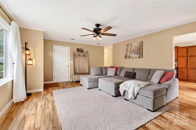 a living room with furniture and a rug