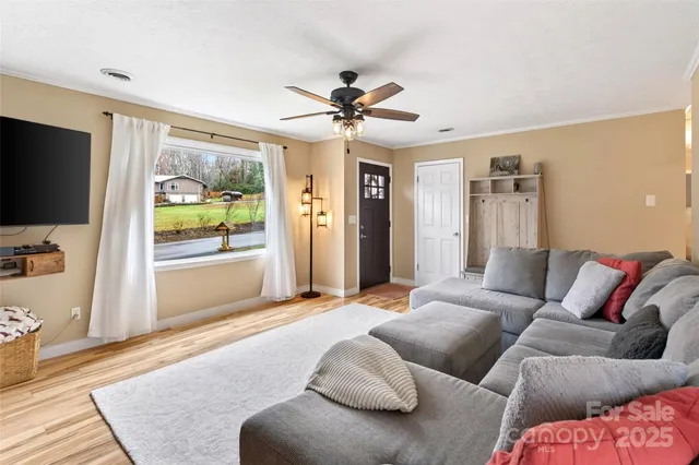 a living room with furniture and a flat screen tv