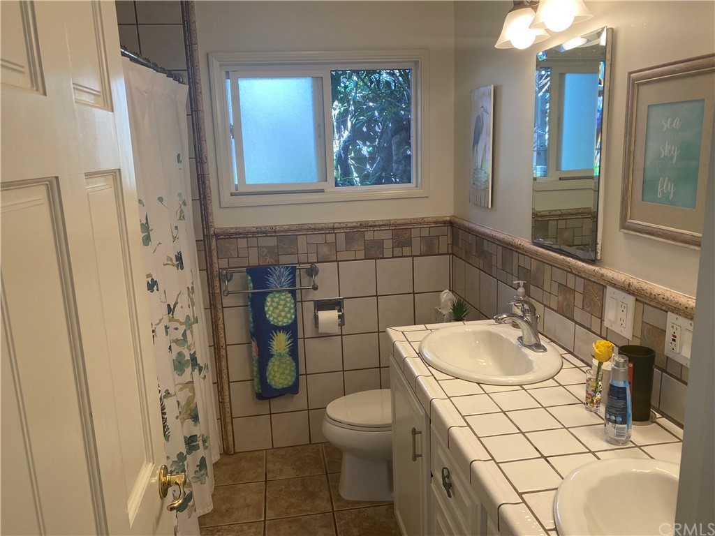 30772 Marilyn Drive Laguna Beach, CA 92651 - Photo 19 of 26 a bathroom with a sink a toilet and shower